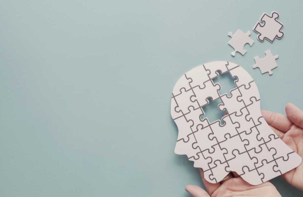 puzzle of human head with missing pieces